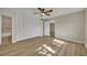 Bright bedroom with wood flooring, large closet, and ceiling fan at 700 Melrose Ave # A 22, Winter Park, FL 32789