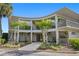 Curved building exterior with landscaping and walkway at 700 Melrose Ave # A 22, Winter Park, FL 32789