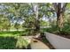 Relaxing walkway under large shade tree with grassy area at 700 Melrose Ave # A 22, Winter Park, FL 32789