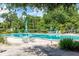 Refreshing community pool area with surrounding patio furniture at 700 Melrose Ave # A 22, Winter Park, FL 32789