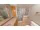 Bathroom with shower, granite vanity and toilet at 711 Dolphin Dr, Tavares, FL 32778