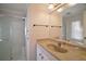 Clean bathroom with single sink vanity and shower at 711 Dolphin Dr, Tavares, FL 32778