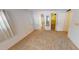 Bedroom with carpet, access to bathroom and closet at 711 Dolphin Dr, Tavares, FL 32778