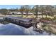 Community boat docks with covered slips and a footbridge at 711 Dolphin Dr, Tavares, FL 32778