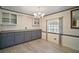 Dining area with built-in cabinetry and wood-look floors at 711 Dolphin Dr, Tavares, FL 32778