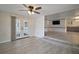 Bright dining area with wood-look floors and access to screened porch at 711 Dolphin Dr, Tavares, FL 32778