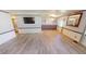 Spacious living room with wood-look floors at 711 Dolphin Dr, Tavares, FL 32778