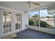 Cozy screened porch with view of the community at 711 Dolphin Dr, Tavares, FL 32778