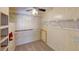 Large walk-in closet with shelving and carpeting at 711 Dolphin Dr, Tavares, FL 32778