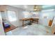Bright workshop with built-in shelving and workbench at 711 Dolphin Dr, Tavares, FL 32778