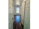 Bedroom with dark wood floors and a large closet at 7132 Holly Creek Rd, Mount Dora, FL 32757