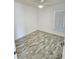 Simple bedroom with wood-look floors at 7132 Holly Creek Rd, Mount Dora, FL 32757