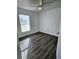 Simple bedroom with wood-look floors at 7132 Holly Creek Rd, Mount Dora, FL 32757