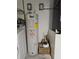 Laundry room with washer, dryer, and water heater at 7132 Holly Creek Rd, Mount Dora, FL 32757