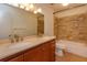 Bathroom with double vanity, tile shower, and updated fixtures at 7482 Canford Ct # 9, Winter Park, FL 32792