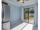 Bright dining area with sliding glass doors leading to backyard at 7482 Canford Ct # 9, Winter Park, FL 32792