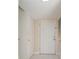 A bright entryway with white door and tile floors at 7482 Canford Ct # 9, Winter Park, FL 32792