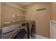 Convenient laundry closet with washer and dryer at 7482 Canford Ct # 9, Winter Park, FL 32792