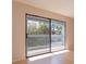 Living room with sliding glass doors leading to balcony at 7482 Canford Ct # 9, Winter Park, FL 32792