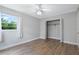 Well-lit bedroom with wood-look floors and a large closet at 802 Rugby St # 802, Orlando, FL 32804