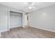 Bedroom with mirrored closet doors and wood-look floors at 802 Rugby St # 802, Orlando, FL 32804