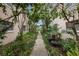 Pathway between buildings with lush landscaping at 802 Rugby St # 802, Orlando, FL 32804