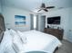 Spacious bedroom with a king-size bed and ocean-themed art at 8044 Lost Shaker Ln, Kissimmee, FL 34747