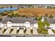 Aerial view of townhouses near a lake at 8136 Tavistock Lakes Blvd, Orlando, FL 32827