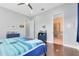 Bright bedroom with ensuite bathroom and hardwood floors at 8136 Tavistock Lakes Blvd, Orlando, FL 32827