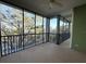 Screened balcony overlooking a wooded area at 910 Gran Bahama Blvd # 910, Davenport, FL 33897