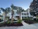 Green building with palm trees and walkway at 910 Gran Bahama Blvd # 910, Davenport, FL 33897