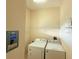 Laundry room with washer, dryer and shelving at 910 Gran Bahama Blvd # 910, Davenport, FL 33897