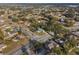 Wide aerial view of a home and surrounding neighborhood near a lake at 922 Fort Smith Blvd, Deltona, FL 32738