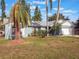 Ranch style home with palm trees and spacious lawn at 922 Fort Smith Blvd, Deltona, FL 32738