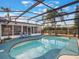 Refreshing kidney-shaped pool with screened enclosure and comfortable seating at 922 Fort Smith Blvd, Deltona, FL 32738