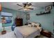 Bright bedroom with a ceiling fan, dresser, and comfortable bed at 1004 Hornbeam St, Oviedo, FL 32765