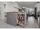 Modern kitchen with a pull-out utensil organizer and island seating at 1004 Hornbeam St, Oviedo, FL 32765