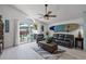 Living room with sliding glass doors, backyard view, and comfortable seating at 1004 Hornbeam St, Oviedo, FL 32765