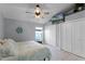 Main bedroom with large closet, ceiling fan, and a window with natural light at 1004 Hornbeam St, Oviedo, FL 32765