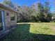 Spacious backyard with grassy area and lush greenery at 1017 Pearl Tree Rd, Deltona, FL 32725