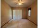 Bright bedroom with carpet flooring and sliding glass doors at 1017 Pearl Tree Rd, Deltona, FL 32725