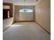 Spacious dining area with chandelier and view to the kitchen at 1017 Pearl Tree Rd, Deltona, FL 32725