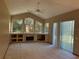 Living room with fireplace and large windows at 1017 Pearl Tree Rd, Deltona, FL 32725