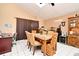 Casual dining area with a table and chairs, adjacent to home office at 1076 Country Cove Ct, Oviedo, FL 32766