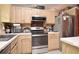 Updated kitchen featuring stainless steel appliances and wood cabinets at 1076 Country Cove Ct, Oviedo, FL 32766