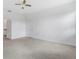 Spacious bedroom with access to bathroom and ceiling fan at 1146 Boardwalk Pl, Kissimmee, FL 34747