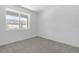 Bright bedroom with neutral carpeting and large window at 1146 Boardwalk Pl, Kissimmee, FL 34747