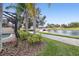 Landscaped backyard with canal views and a relaxing walkway at 12161 Obelia Ln, Orlando, FL 32827