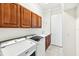 Laundry room with washer, dryer, and ample cabinetry at 12161 Obelia Ln, Orlando, FL 32827