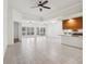 Open living space with high ceilings, tile floors, and sliding glass doors at 12161 Obelia Ln, Orlando, FL 32827